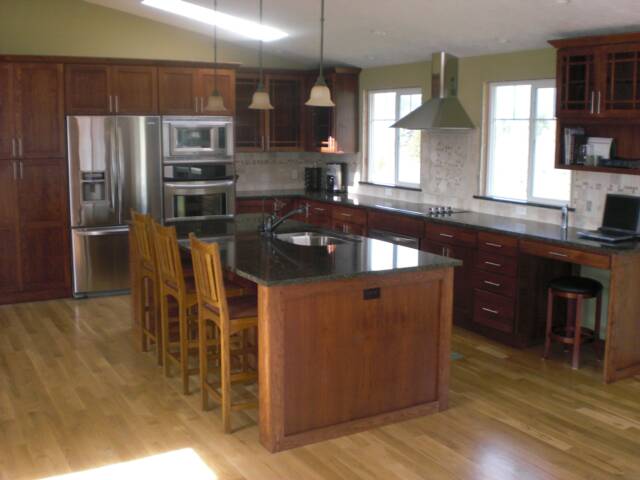 Cherry Cabinets, Solid Slab Granite Counters, Travertine Backsplash, Stainless Steel Appliances, Oak Hardwood Floors